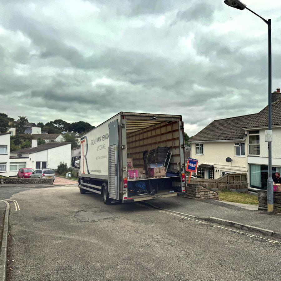 Dodging the raining and loading in Falmouth on the second day of a full pack and move to Plymouth.